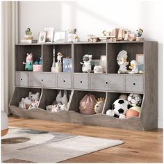 a bookcase filled with lots of stuffed animals