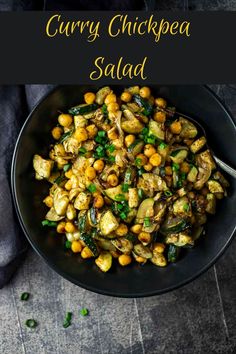 curry chickpea salad in a black bowl on a gray table with text overlay