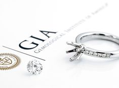 a close up of a diamond ring on top of a piece of paper with the word gaia written below it