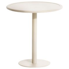 a white table with a round base on the top and one leg in the middle