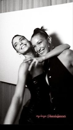 black and white photograph of two women hugging each other