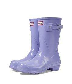 PRICES MAY VARY. The Women's Original Short Rain Boot is a shorter version of the iconic Hunter Original Tall Boot and perfect for wet-weather conditions. Formed of natural rubber, each boot is handcrafted and assembled over three days and then vulcanised for superior protection before having the high gloss finish applied. The Hunter Original tread pattern and comfortable 100% recycled polyester lining completes the design on this 100% waterproof boot. Purple Rain Boots, Short Rain Boots, Tall Boot, Women Hunters, Rain Boot, The Hunter, Wet Weather, Kids Luggage, Purple Rain