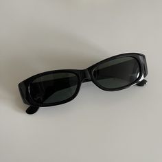 These slim rectangle sunglasses are your everyday classic. Featuring a black frame with black smoke lens. This style is unisex. True genuine vintage sunglasses from the 90s.  - 400 uv  - new vintage from the 90s Measurements:  Frame width: 139mm Lens Height: 30mm  Lens Width: 49mm  Bridge: 19mm  Arm temple: 140mm - includes sunglasses pouch  Also available in tortoise Rectangle Sunglasses Aesthetic, Pointy Sunglasses, Black Rectangle Sunglasses, Black Sunnies, Dapper Day Outfits, Sunglasses Rectangle, 90s Sunglasses, Sunglasses Pouch, Outfit Inspo Summer