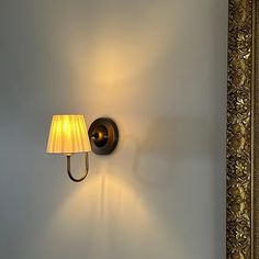 a lamp that is on the side of a wall