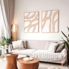 a living room with two paintings on the wall