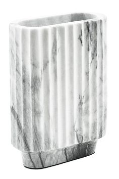 a black and white photo of a marbled planter with vertical stripes on it