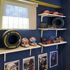 a room with blue walls and shelves filled with racing memorabilia