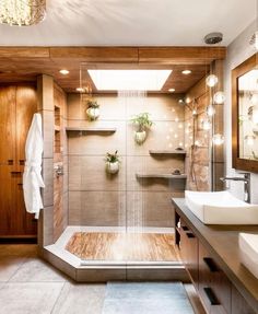 a bathroom with two sinks and a shower