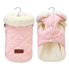 a pink quilted dog coat with white fur on the collar and cuffs, hanging from a hook