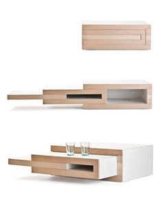 two white and wood shelves with drinks on them, one in the shape of a coffee table