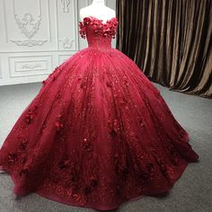 Make a bold statement and shine with regal beauty in this Exquisite Red Quinceanera Dress. This dress is crafted from luxurious red tulle, the ball gown silhouette offers a voluminous and elegant fit, flowing effortlessly into a stunning cathedral train that trails behind you for added drama and sophistication. The strapless neckline creates a timeless, classic look, drawing attention to your shoulders and neckline, while the sleeveless design ensures both comfort and grace. The gown’s standout Red Debut Dress, 18th Debut Dress, Burgundy Quince Dress, Burgundy Quince Dresses, Dark Red Quinceanera Dresses, Rose Gold Quinceanera Dresses, Red Quinceanera Dress, Quinceanera Dresses Red, Rose Gold Quinceanera