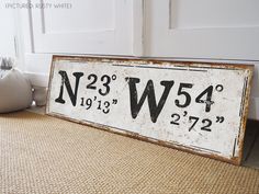 a sign that says n235 w45 on the side of a door way