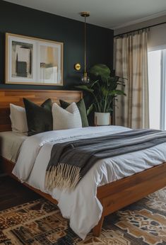 a bedroom with green walls and white linens on the bed, along with potted plants