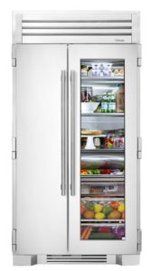 a refrigerator with its doors open and food in the freezer door is opened to show what's inside