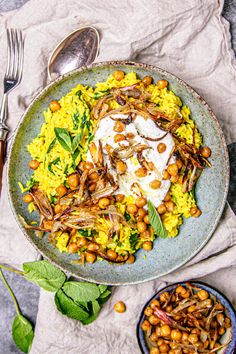 a plate with rice, beans and meat on it