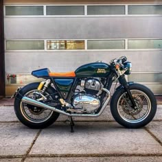 a motorcycle parked in front of a garage