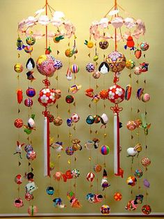 an art work with many ornaments hanging from it's sides