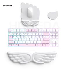 a computer keyboard with angel wings on it