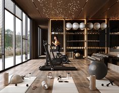 a woman is running on a treadmill in a room full of balls and exercise equipment