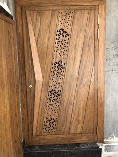 a wooden door with laser cut designs on the front and side panels that are made out of wood