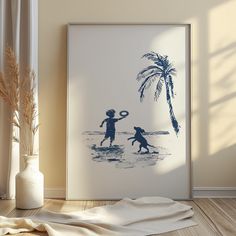 two children playing with a frisbee on the beach in front of a palm tree