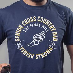 a man wearing a navy blue shirt with the words senior cross country run on it