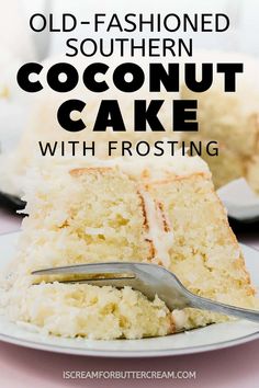 an old - fashioned southern coconut cake with frosting is on a white plate and has a fork in it