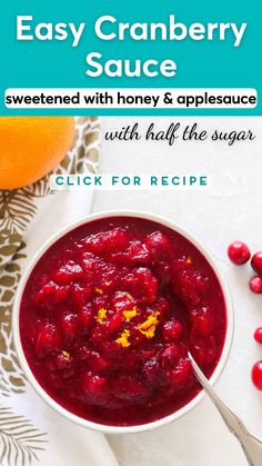 cranberry sauce in a white bowl with oranges on the side