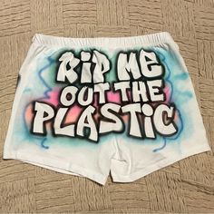 The "Rip Me Out The Plastic" Cheeky Shorts. Also Referred To As Freaknik Shorts Or Amplify Shorts. Custom Airbrushed. Extremely Stretchy. These Are Usually Only Made By Order. Because Of The Demand Ended Up Making A Few Extras. This Is One Of The Last Two I Have Left. For Size Reference The Model Is Wearing A Medium. She Is About 5'5 In Height. Women’s Graphic Shorts, Airbrush Skirt Set, Streetwear Athletic Shorts With Built-in Shorts, Air Brush Shorts, Moisture-wicking Shorts For Streetwear, Airbrush Clothes, Painted Shorts, White Joggers, Black Lounge