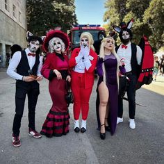 group of people dressed up in costumes posing for the camera