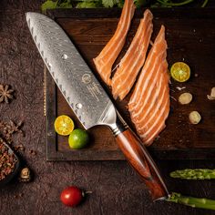 a knife and some fish on a cutting board