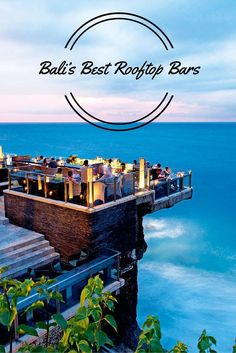 an outdoor restaurant overlooking the ocean with text overlay that reads bali's best rooftop bars