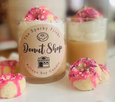 Donut Shop, realistic and scrumptious smelling mini frosted donuts dunked in a complex vanilla and NYC Donut Shop fragrance with hints of berries and whipped cream!  So cute for birthdays, besties, or any party or occasion.  Smells amazing even when  UNLIT!   By far my favorite donut scent  This donut scent is inspired by NYC's iconic donut shops. It opens with the inviting notes of Ambrette seed and nutmeg, evoking the bustling bakery atmosphere. A gourmet blend of rosewater, berry, creamy vanilla, tonka bean, and caramel, reminiscent of artisanal donuts. The base notes of sheer amber, sweet musk, and sandalwood add depth and warmth, while hints butter, yeast, and roasted hazelnut capture the essence of freshly baked treats.  Real sized mini frosted pink donuts, nestled in whipped warm va Amber Sweet, Donut Shops, Dessert Candle, Baked Treats, Pink Donuts, Bakery Desserts, Donut Shop