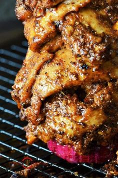 some kind of meat sitting on top of a grill