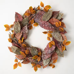 a wreath made out of leaves on a white background