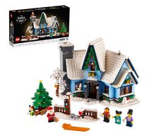 a lego christmas house is shown in front of a box with it's contents