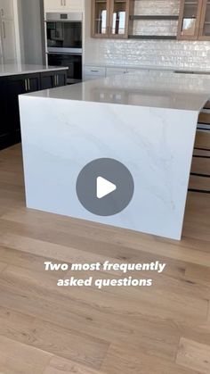 a white counter top sitting inside of a kitchen