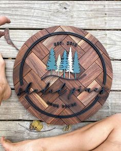 a person sitting on a wooden floor next to a sign that says lake tahoe