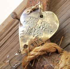 a metal heart shaped keychain that says you are the greatest catch i have ever seen