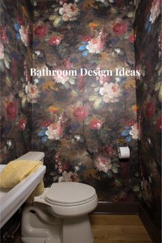 a bathroom with floral wallpaper and toilet