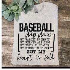 a t - shirt that says baseball mom, but my heart is full