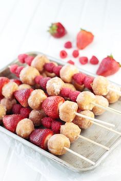 strawberries and sugar coated donuts on skewers