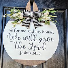 a wooden sign that says as for me and my house we will serve the lord