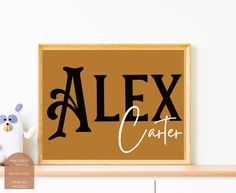 a wooden sign that says alex crater on it next to a teddy bear and other items