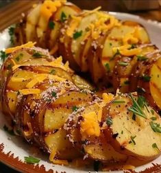 sliced potatoes with cheese and herbs on a plate