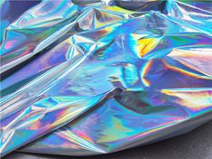 the holographic material is shiny and iridescent, but it doesn't look like that