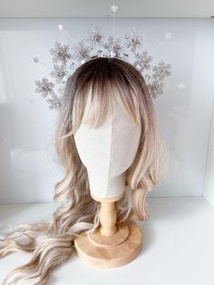 Embrace the magic of winter with this enchanting snowflake crown. Adorned with shimmering snowflakes, sparkling stars, and delicate crystals, this piece is perfect for adding a touch of festive flair to any outfit. Whether you're attending a winter wonderland party, a holiday celebration, or simply want to channel your inner snow queen, this crown is sure to make a statement. SIZE: It is suitable both for a child and an adult. MATERIAL: high-quality artificial snowflakes, and high-quality accessories. 100% handmade I accept individual orders The order is packed in a cardboard box and beautifully decorated inside. ? Ask what interests you and we will be happy to answer your questions. DELIVERY: I will notify you when the package is on the way. I will also send a tracking number for your ord Winter Ball Crown, Ice Icicles Crystal Crown, Snowflake Headbands, Braut Winter, Ice Queen Crown, Snowflake Costume, Snowflake Crown, Winter Wonderland Outfit, Snowflake Headband