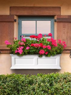 a window box with pink flowers in it