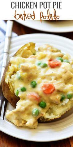 an open faced chicken pot pie on a plate with a fork and knife next to it