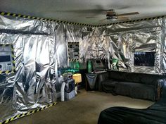 a living room covered in aluminum foil and furniture